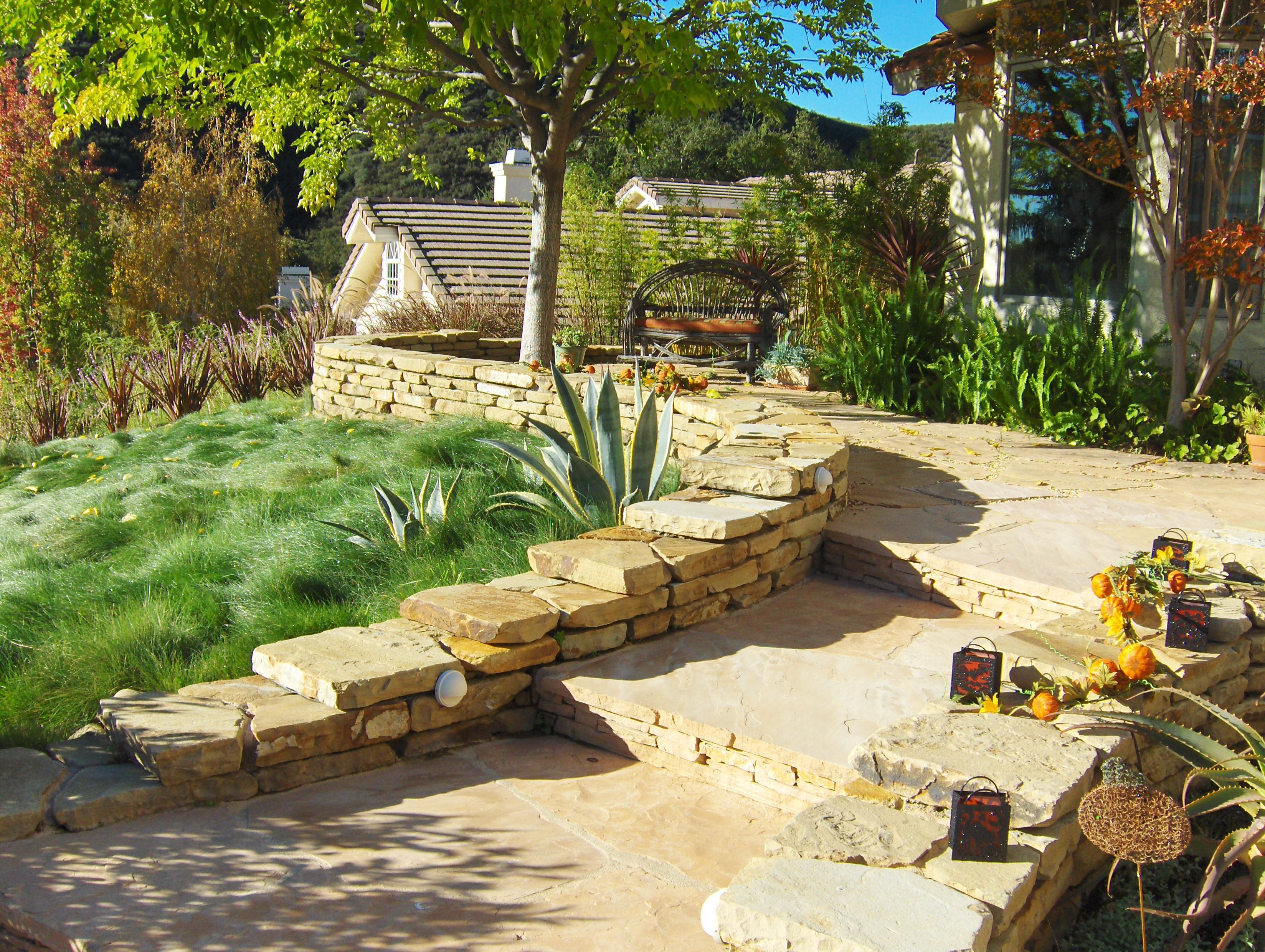 Entryway steps with lush garden adornments.